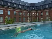 Photo by J on July 03, 2026. May be an image of swimming, pool, brick wall and text.webp