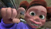 Darla_poking_the_glass_of_the_fishtank.webp