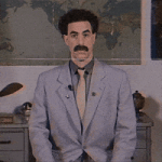 Movie gif. Sacha Baron Cohen as Borat sits in front of a map and raises his two thumbs, waggling his eyebrows and giving an approving nod and toothy grin. Movie gif. Sacha Baron Cohen as Borat sits in front of a map and raises his two thumbs, waggling his eyebrows and giving an approving nod and toothy grin.